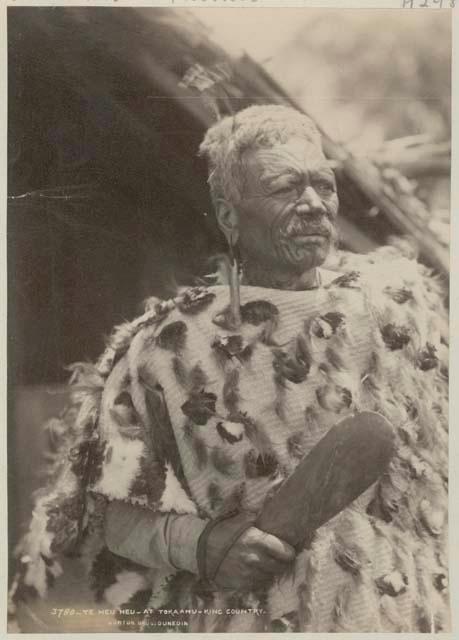 Portrait, Maori man holding club