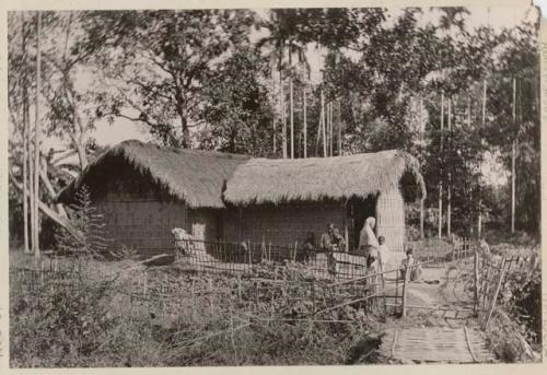 People in front of a house