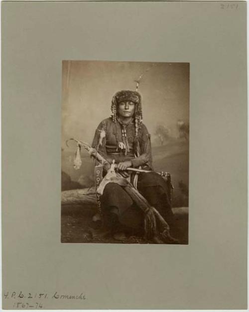 Studio portrait of Comanche man.