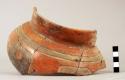 Partially restored polychrome pottery vessel