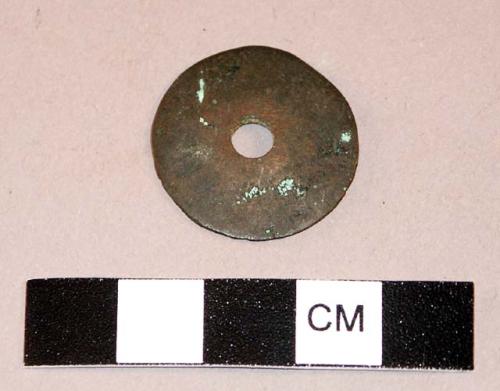 Metal spindle whorl (?)