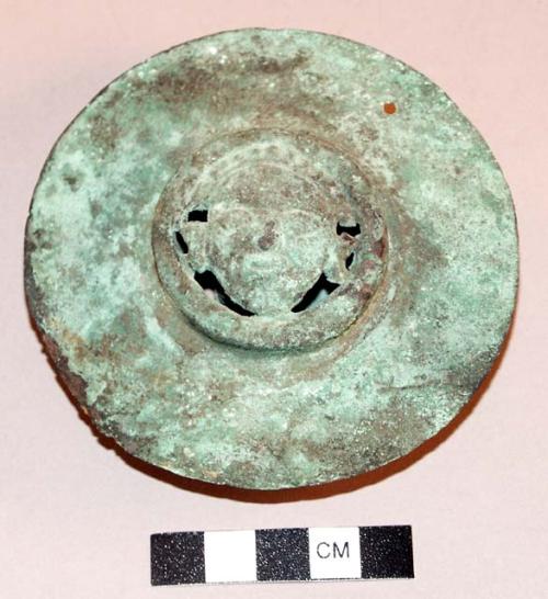 Disc-shaped copper rattle