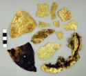 Fragments of embossed gold disks