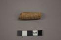 Ceramic pipe stem fragment incised with linear designs