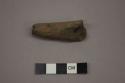 Ceramic pipe fragment with incised, linear designs