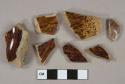 Brown and tan mottled decorated earthenware vesssel body fragments, buff paste, rockingham type