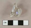 Colorless glass vessel fragment, likely lid knob or stemware fragment