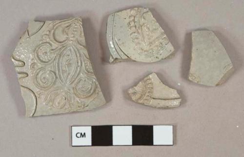 Gray salt glazed stoneware vessel body fragments, tan interior, gray paste, molded decoration, westerwald type