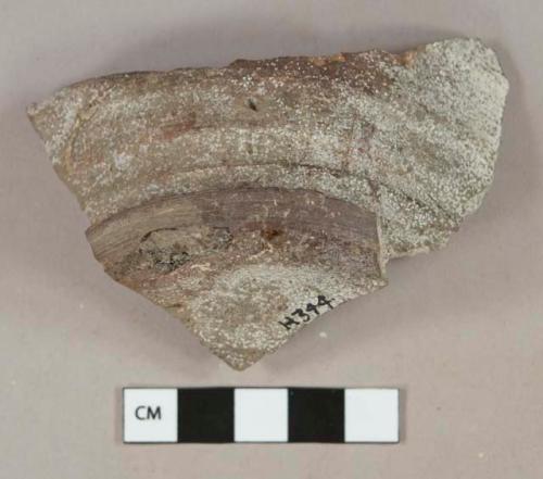 Dark brown lead glazed redware vessel base fragment