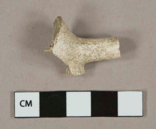 White undecorated kaolin pipe stem fragment, stamped decoration on foot