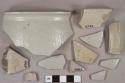 Gray salt glazed stoneware vessel body, rim, and handle fragments, gray paste, undecorated
