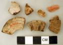 Fish vertebrae fragments, possibly worked; chipped flint blade fragment