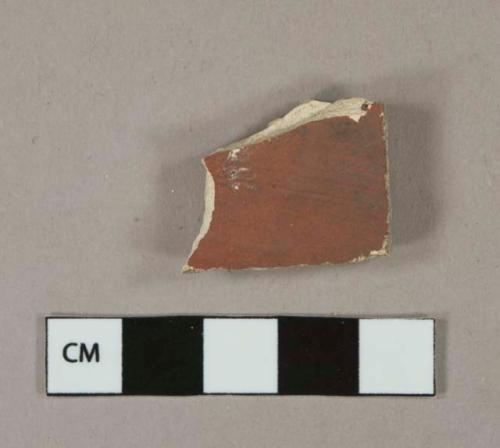 Cream salt-glazed exterior, red unglazed interior vessel body fragment