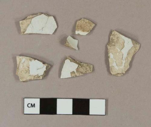 Undecorated pearlware body sherds; two sherds crossmend