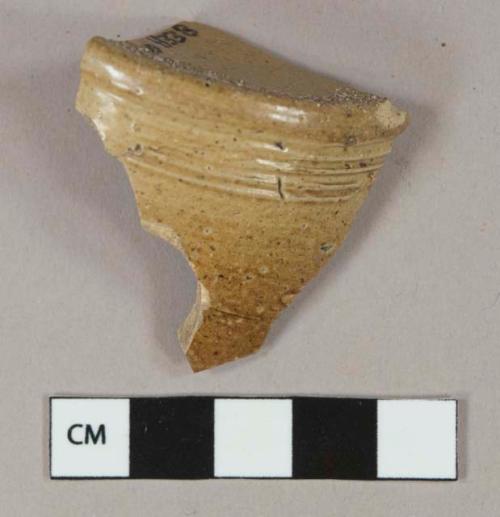 Brown salt glazed stoneware vessel base fragment, gray paste