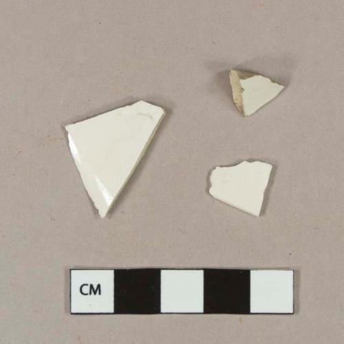 Undecorated whiteware body sherds; two sherds crossmend with undecorated whiteware rim sherd