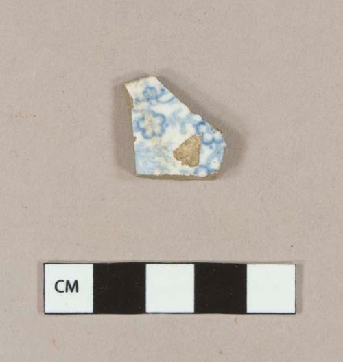 Blue transfer printed whiteware rim sherd