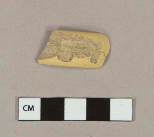 Undecorated yellow ware handle sherd