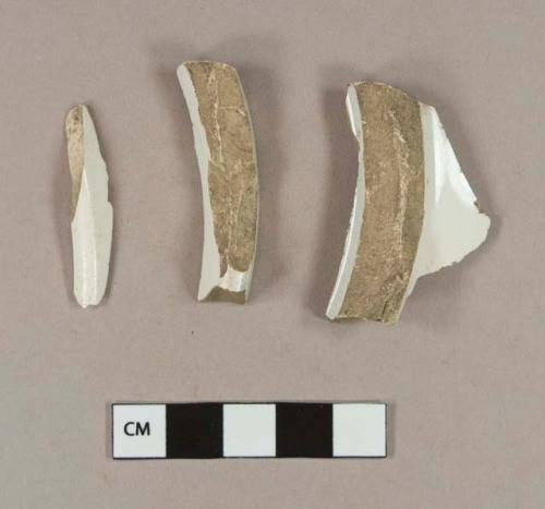 Undecorated whiteware base sherds; three sherds crossmend