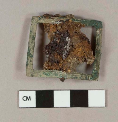 Cuprous alloy buckle frame with ferrous conglomerate at center, slight decoration