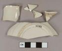 White salt glazed stoneware vessel body and base fragments, white or light gray paste
