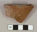 Reddish brown salt-glazed stoneware vessel base fragment, gray paste