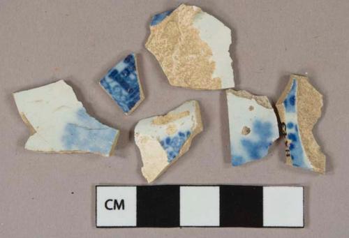 Flow blue on white transferprinted earthenware vessel body fragments, white or light buff paste