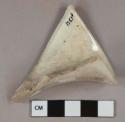 Undecorated white lead glazed earthenware vessel spout fragment, likely pitcher, white paste
