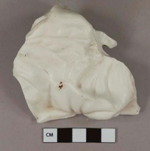 White unglazed porcelain vessel body fragment, molded