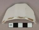 White porcelain vessel rim fragment, gilt decorated rim, paneled sides