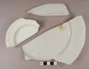 Undecorated white porcelain plate and saucer body, base, and rim fragments, most partial, white paste
