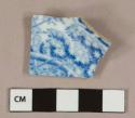 Blue on white transferprinted pearlware vessel base fragment, white or light buff paste