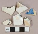 White pearlware vessel body fragments, 1 black transferprinted fragment, 1 blue transferprinted fragment, white paste