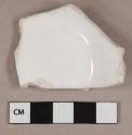 White undecorated porcelain vessel base fragment, paneled sides, white paste