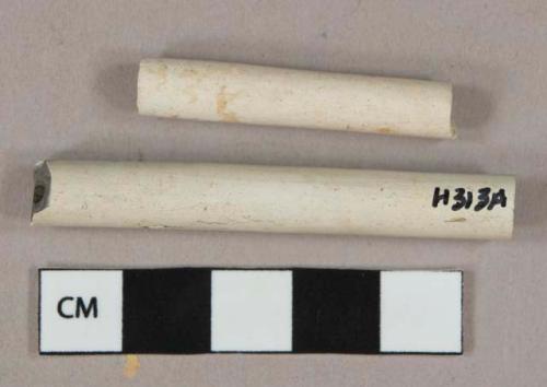White undecorated kaolin pipe stem fragments, 1 with stamp "[...]ON LIVERPOOL," 1 with 4/64" bore diameter, 1 with 5/64" bore diameter