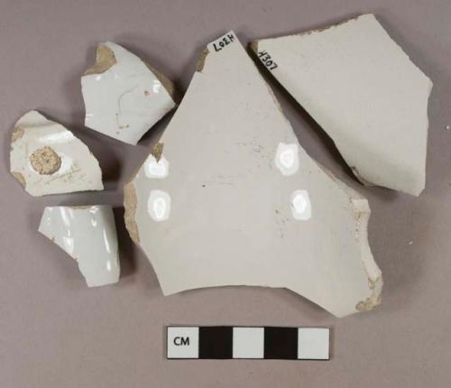 White undecorated lead glazed ironstone vessel body and rim fragments, white paste