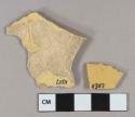 Undecorated yellow ware vessel body fragments, buff paste