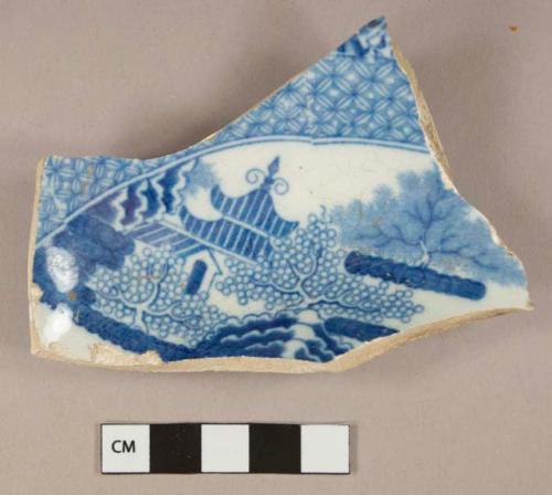 Blue on white transferprinted pearlware vessel base fragment, white paste