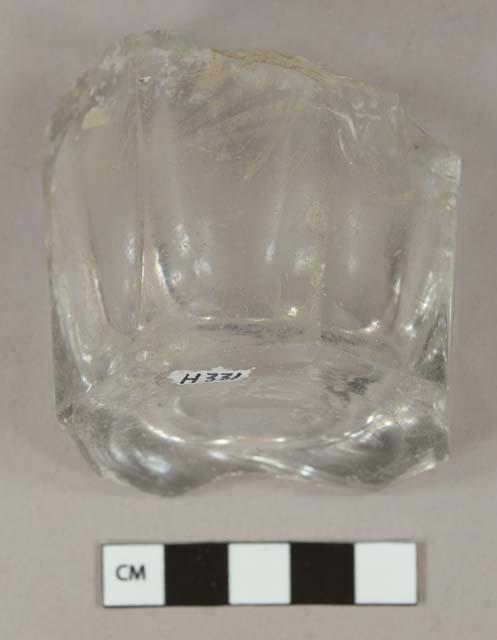 Colorless glass tumbler base fragment, paneled sides, post bottom