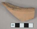 Unglazed terra cotta vessel body fragment