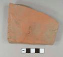 Unglazed terra cotta tile fragment