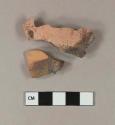 Burned, impressed redware body sherds; two sherds crossmend