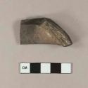 Unidentified burned ceramic base sherd, refined earthenware or stoneware; fragments of light-colored glaze