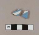 Blue hand painted whiteware body sherds; two sherds crossmend