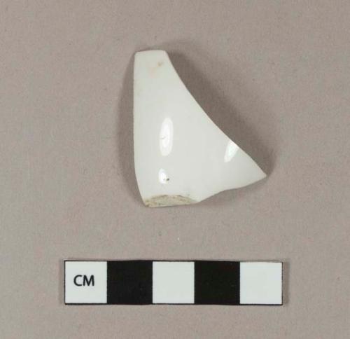 Undecorated porcelain base sherd; crossmends with base and rim sherd