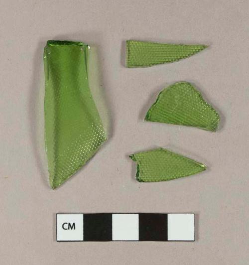 Molded green bottle glass fragments