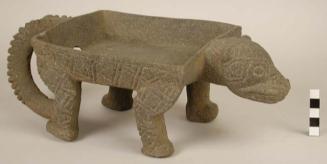 Stone effigy metate