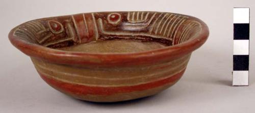 Unpainted bowl with dark red lines incised in the form of a rectangle