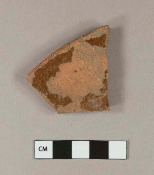 Undecorated lead glazed redware base sherd