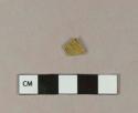 Yellow bottle glass fragment